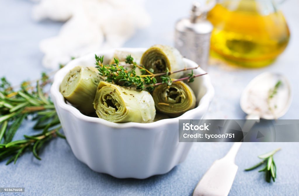 Artichoke hearts Artichoke hearts in white bowl , Artichoke hearts with marinade Artichoke Stock Photo