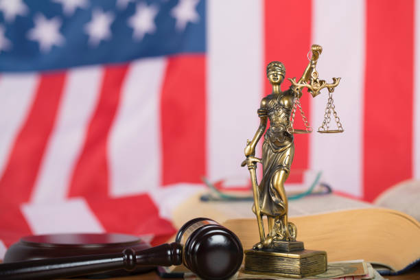 istock Statue of Themis and judge's gavel on a table. 923674972