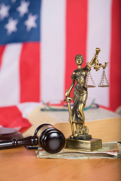 istock Statue of Themis and judge's gavel on a table. 923675082