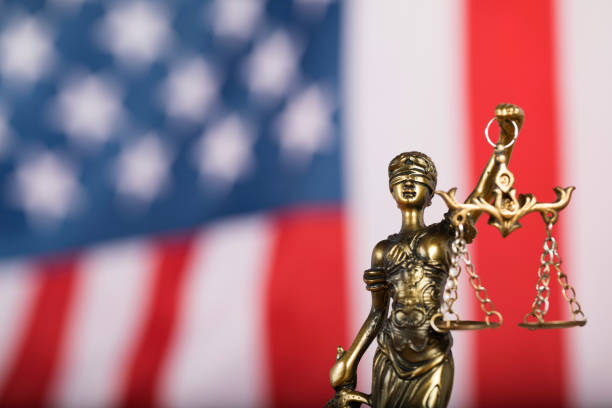Statue of Themis in front of American flag Statue of Themis. Judge's gavel, and flag of USA in the background legal trial photos stock pictures, royalty-free photos & images
