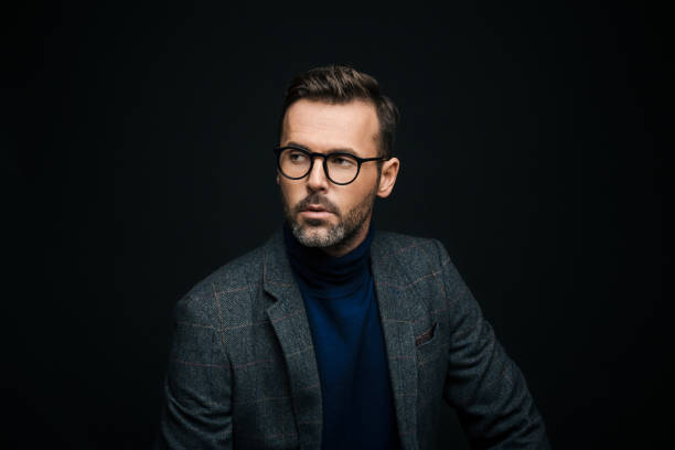 istock Studio portrait of elegant man, dark background 923677524