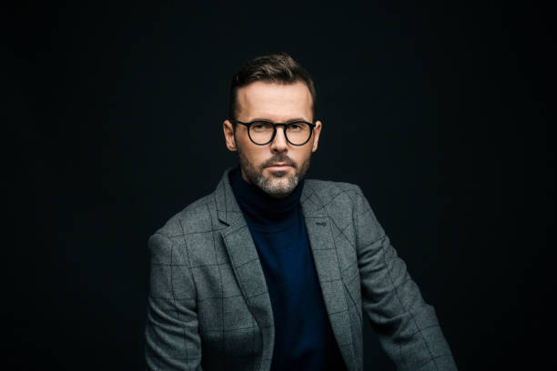 istock Studio portrait of elegant man, dark background 923677618