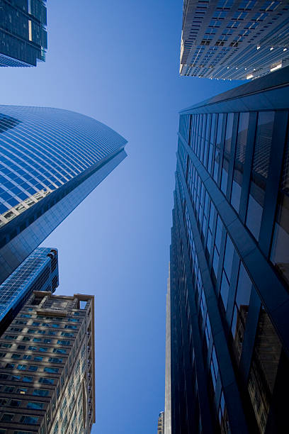 istock Looking up at blue glass modern office building in Chicago 92367781