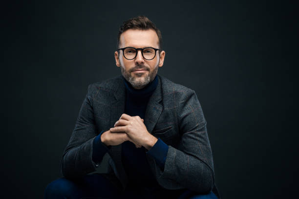 istock Studio portrait of elegant man, dark background 923678086