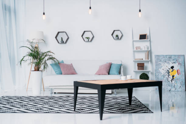 istock wooden table and sofa with pillows in room 923678538