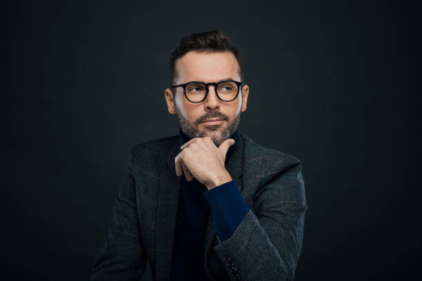 istock Studio portrait of elegant man, dark background 923681266