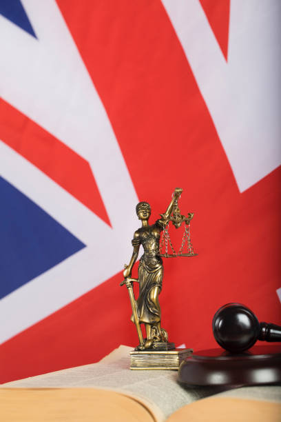 istock Statue  Themis on a flag of Great Britain. 923681348