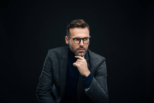 istock Studio portrait of handsome male designer, dark background 923682474