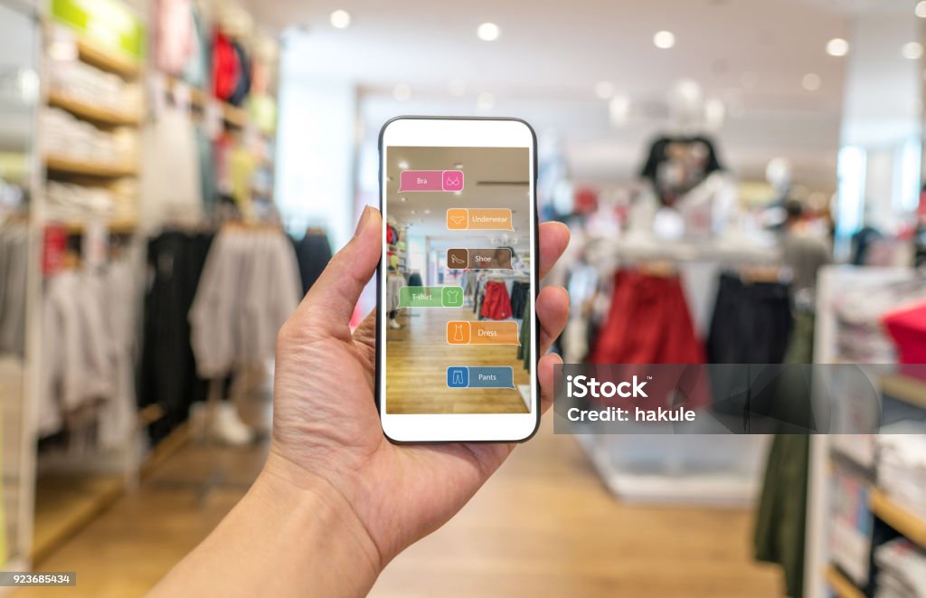 Augmented reality marketing . Hand holding smart phone use AR application to check information Retail Stock Photo