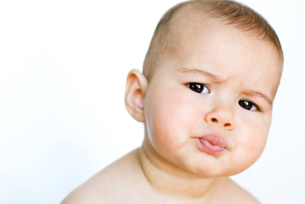 cute baby girl  making a face stock pictures, royalty-free photos & images