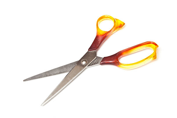 istock Scissors with orange handles isolated on white 92369172