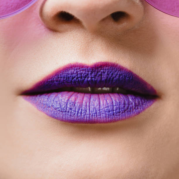 istock cropped image of female purple lips 923702360