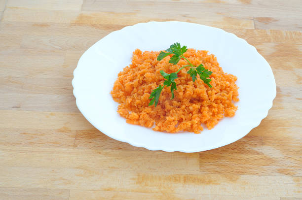 istock minced orange carrot and green parsley in a dish 923702724