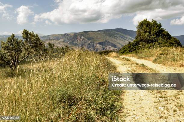 Country Lane At Euboea An Greek Island Stock Photo - Download Image Now - Agricultural Field, Cloud - Sky, Country Road