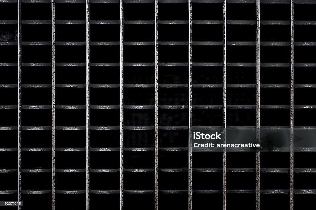 Worn Metal Grate A metal subway grate texture that is worn and weathered. Abstract Stock Photo