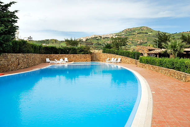 istock Old sicilian city with swimming pool in front 92371390