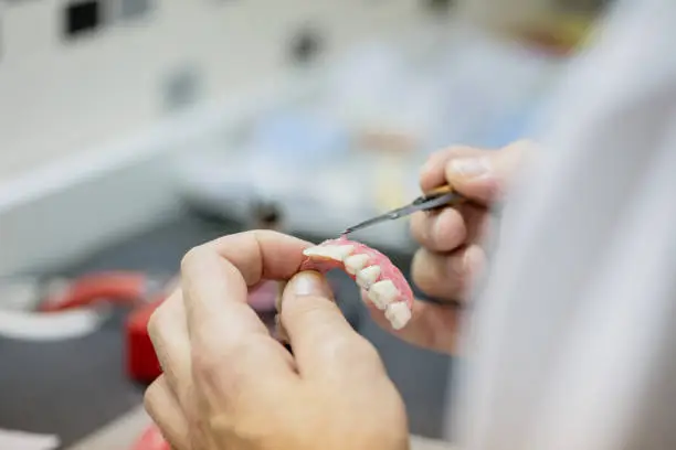 Close-up of man making a dental prosthesis
