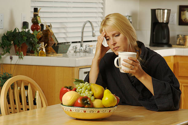 istock Pensive Woman in Kitchen 92372812
