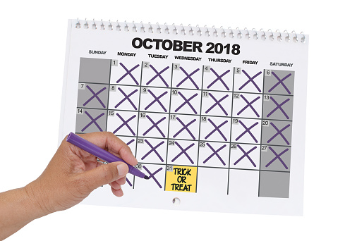 Countdown to Trick or Treat Halloween calendar hand strike through white background