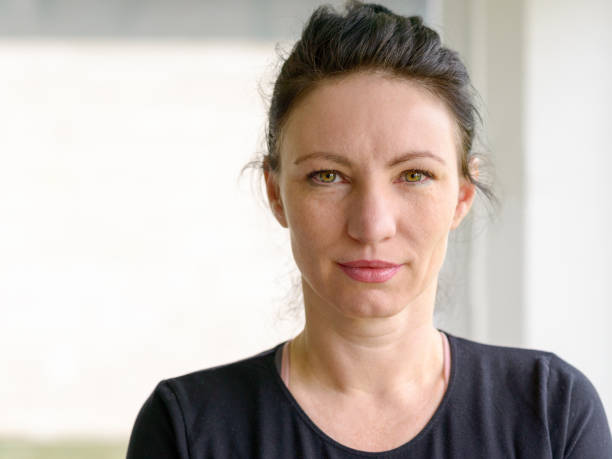 istock Attractive serious woman looking at the camera 923729406