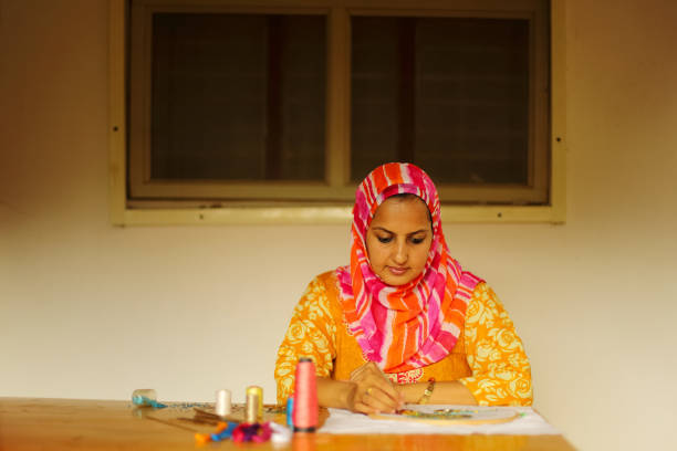 istock Muslim Woman Doing Embroidery 923732568
