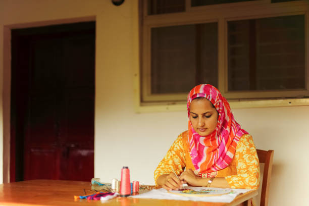 istock Muslim Woman Doing Embroidery 923732646