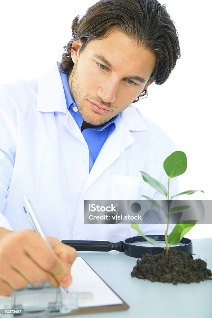 Serio Scienziato scrivere rapporto di ricerca - Foto stock royalty-free di Adulto