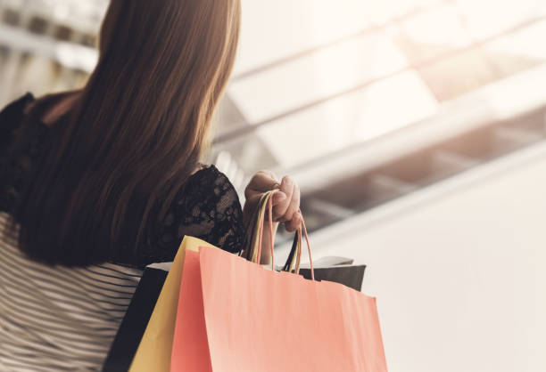 istock Woman with shopping bags 923736928