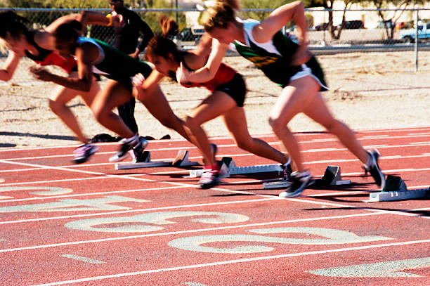Off the Blocks  womens track stock pictures, royalty-free photos & images
