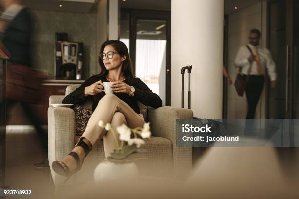 Businesswoman Waiting At Airport Lounge Stock Photo - Download Image Now - Airport Departure Area, Airport VIP Lounge, Airport