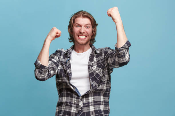 istock Winning success man happy ecstatic celebrating being a winner. Dynamic energetic image of male model 923749270