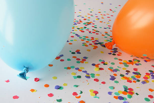 istock Blue and orange balloons with confetti 92375082