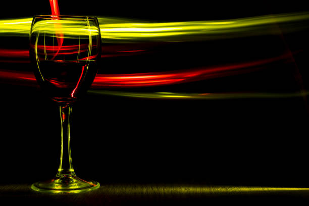 istock A glass of wine on the table. Light effect. 923751862