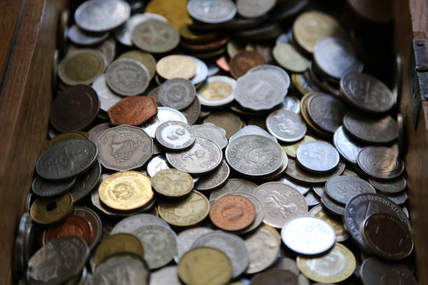 istock Coins mixed collection, gathered in a wooden box. 923752398