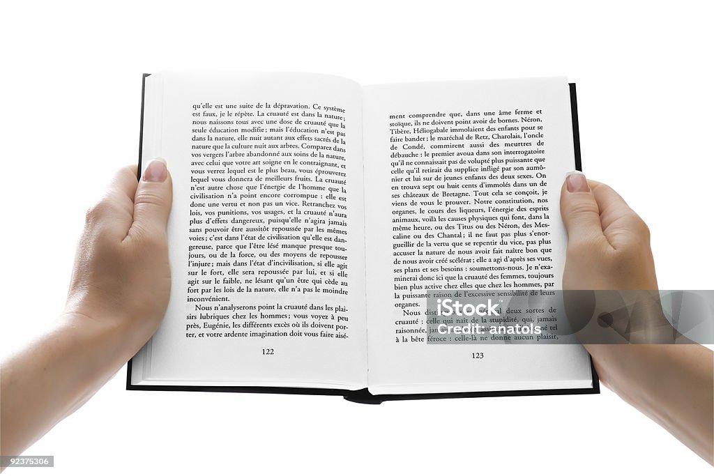 Donna mani tenendo il libro aperto su bianco - Foto stock royalty-free di Libro