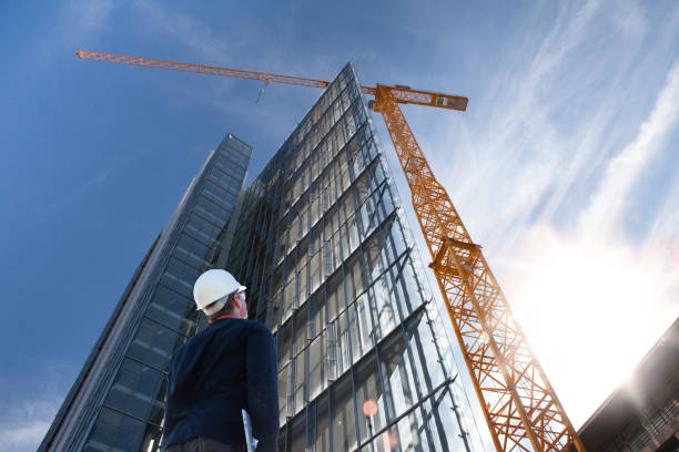 engineer architect working on construction site with laptop - fotografia de stock