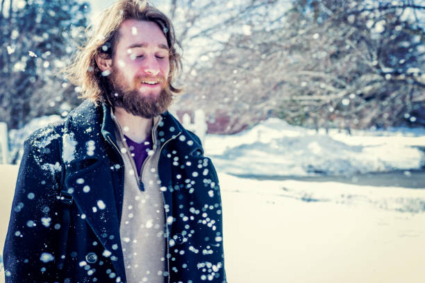istock University student standing firm as he is hit with a snowball 923761382