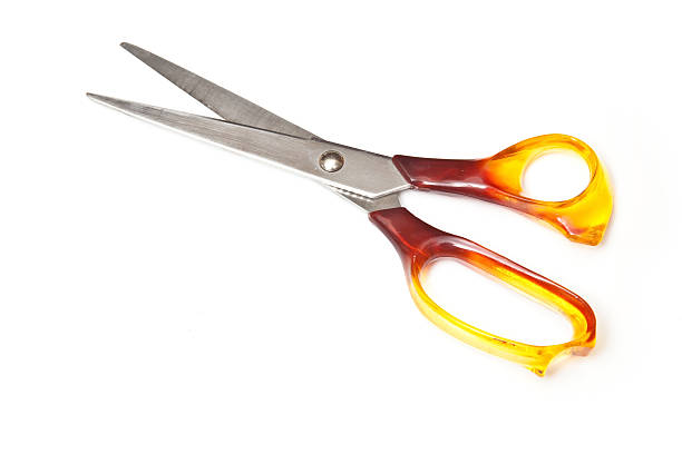 istock Scissors with orange handles isolated on white 92376319