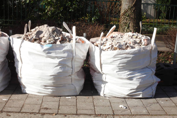 White garbage bags with rubbish stock photo