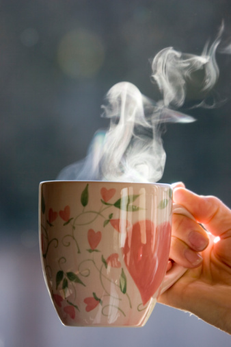 A steaming hot cup of coffee