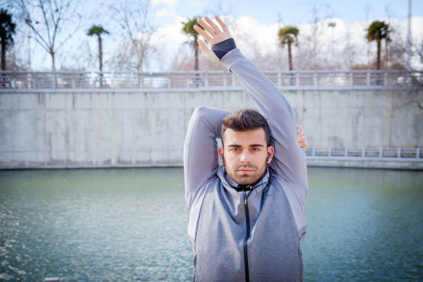 Young athlete man is doing sport runing stock photo