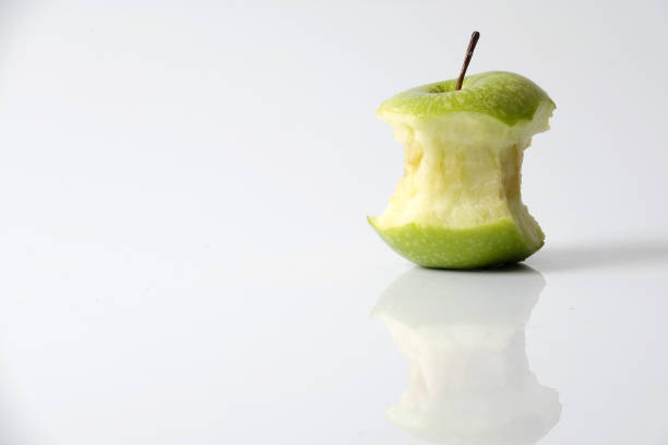 istock Close-Up On Eaten Granny Smith Apple Against White Background 923766466