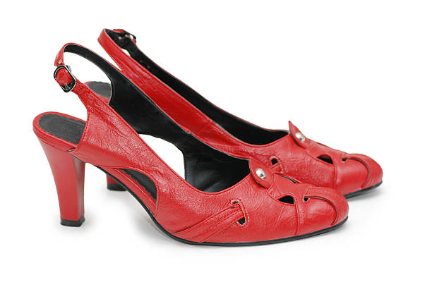 Close-Up Of Red Shoes Over White Background
