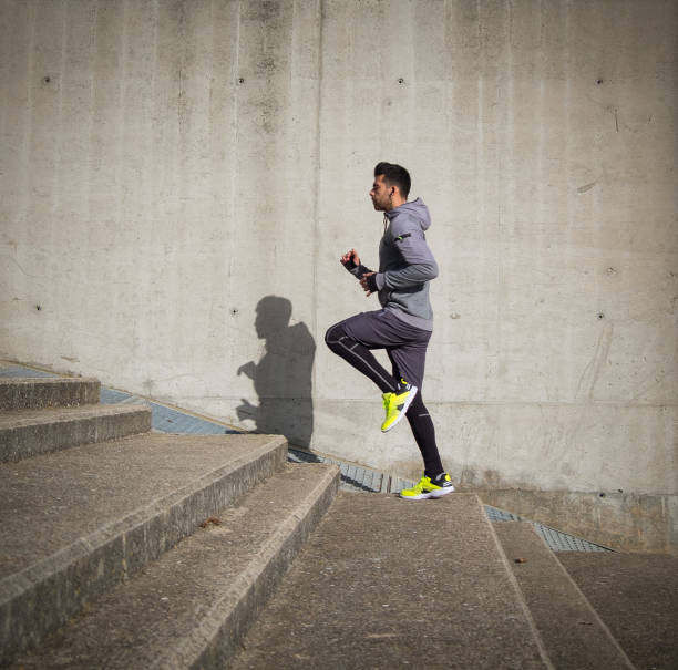 Young athlete man is doing sport runing stock photo