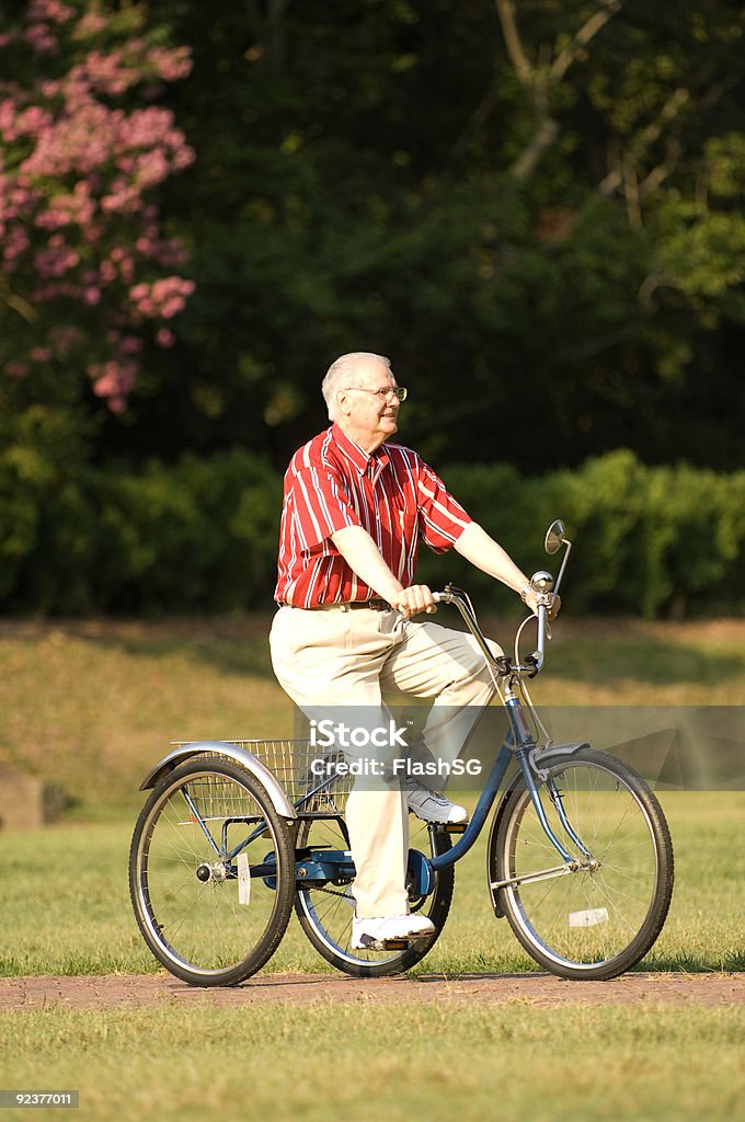 Elderly Man Taking A Ride On Bike  70-79 Years Stock Photo