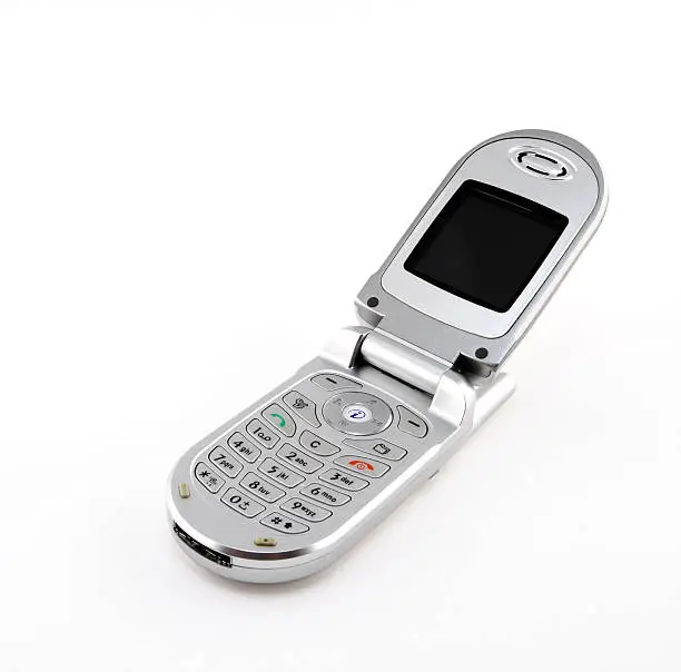 Modern silver clamshell cell phone.