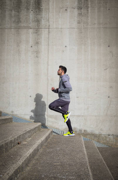 Young athlete man is doing sport runing stock photo