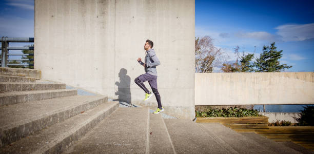 Young athlete man is doing sport runing stock photo