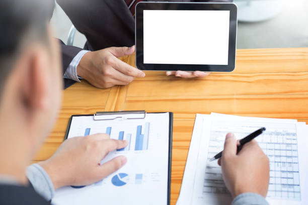 istock High Angle View Of Business Colleagues Working At Office 923773138