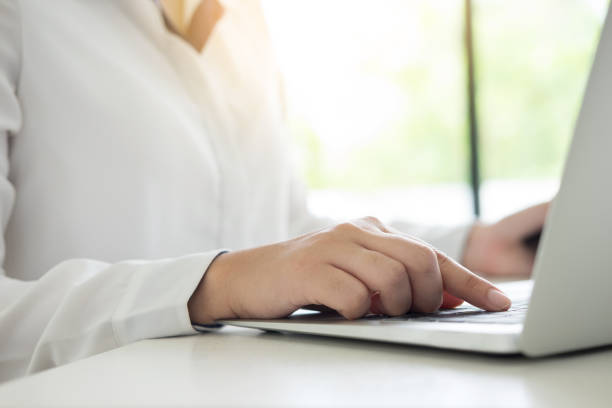 istock Midsection Of Woman Using Laptop On Table 923775384